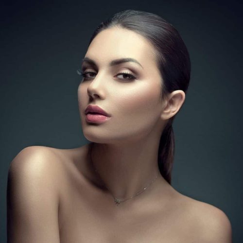 Beauty Brunette Woman with Perfect Makeup. Beautiful skin and Pr